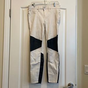 Size 29 Bebe skinny white jeans with black coated accent.